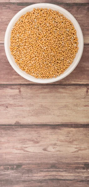 Mustard seeds in the white bowl — Stock Photo, Image