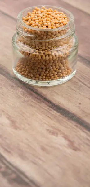 Mustard seeds in the glass jar — Stock Photo, Image