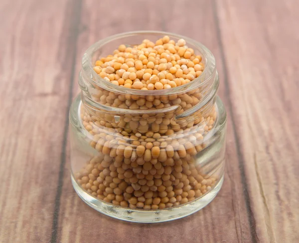 Mustard seeds in the glass jar — Stock Photo, Image