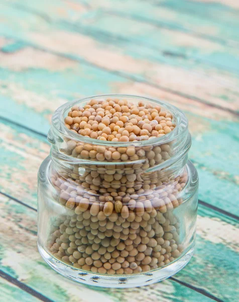 Mustard seeds in the glass jar — Stock Photo, Image