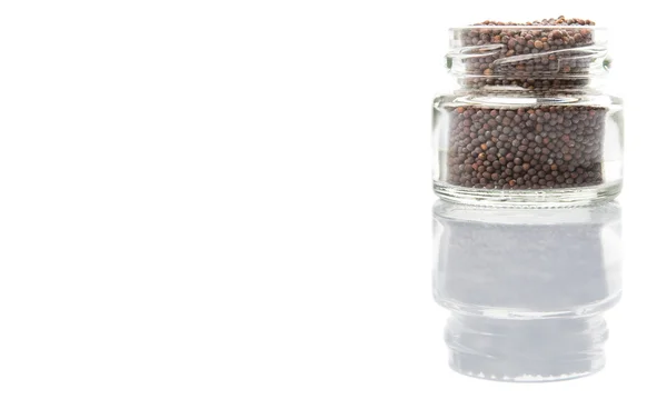 Hořčičná semena ve skleněné nádoby — Stock fotografie