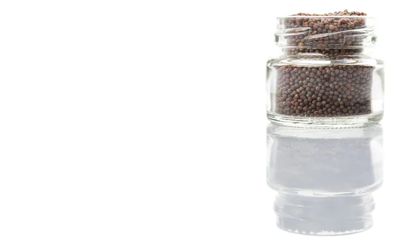 Mustard seeds in the glass jar — Stock Photo, Image