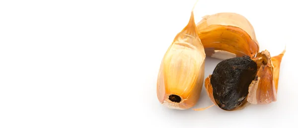 Caramelized cloves of black garlic — Stock Photo, Image