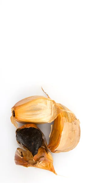 Caramelized cloves of black garlic — Stock Photo, Image