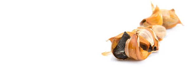 Caramelized cloves of black garlic — Stock Photo, Image