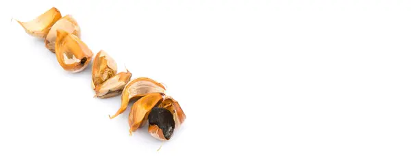 Caramelized cloves of black garlic — Stock Photo, Image