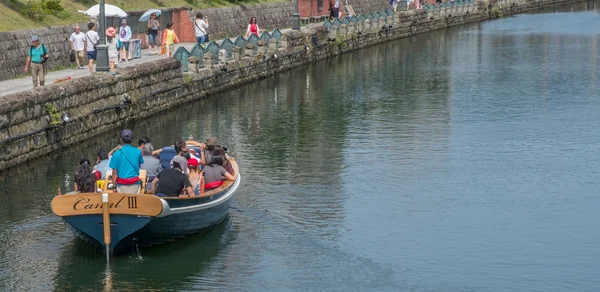 Tourists sightseeing in the street of Otaru City, Japan.