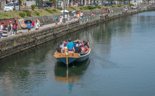 Tourists sightseeing in the street of Otaru City, Japan.