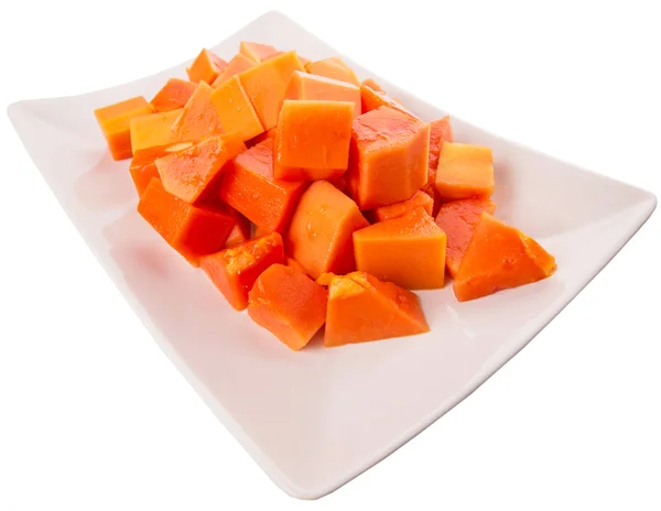 Bita stora papaya frukt på vit platta — Stockfoto