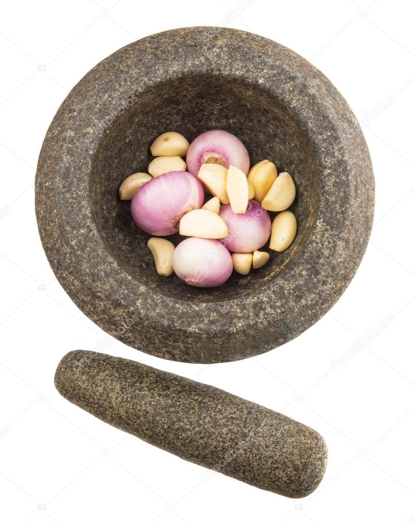 Stone Mortar And Pestle With Onions And Garlic