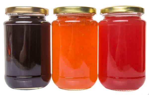 Bosbessen, aardbeien en oranje vruchten gebotteld jam — Stockfoto