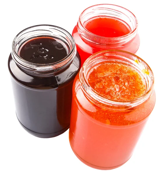 Jagód, truskawek i pomarańczowe owoce otwarcia pokrywy butelkach dżem — Zdjęcie stockowe