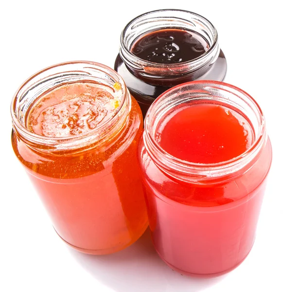 Blåbär, jordgubb och orange frukt Öppna locket på flaska sylt — Stockfoto