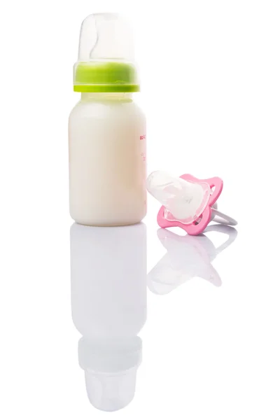 Baby Pacifier And A Bottle Of Baby Formula Milk — Stock Photo, Image