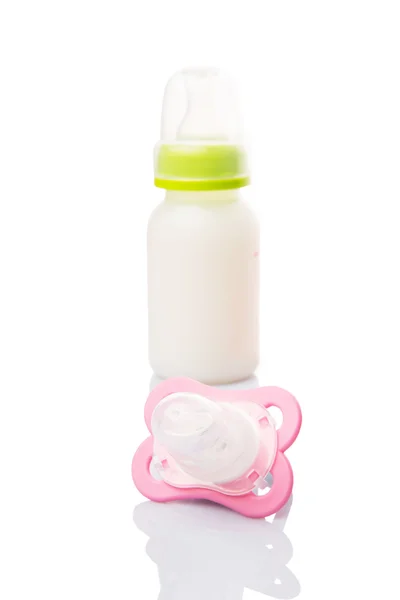 Baby Pacifier And A Bottle Of Baby Formula Milk — Stock Photo, Image