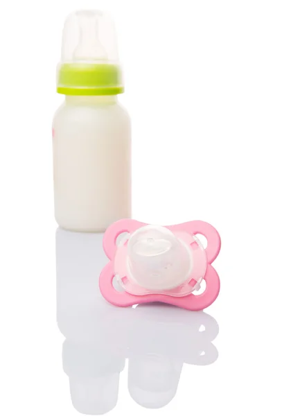 Baby Pacifier And A Bottle Of Baby Formula Milk — Stock Photo, Image