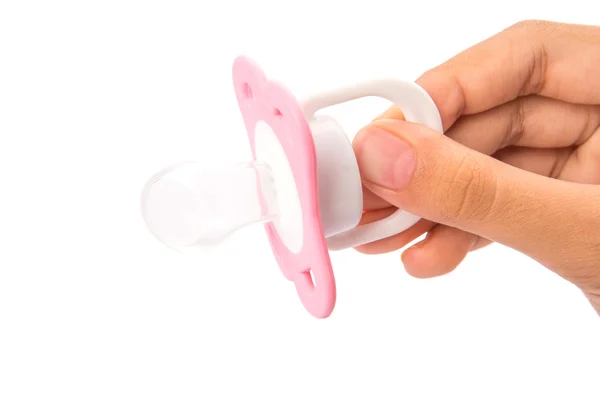 Female Hand Holding Pink Pacifier — Stock Photo, Image