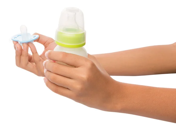 Female Hand Holding A Blue Pacifier With A Bottle Of Baby's Milk — Stock Photo, Image