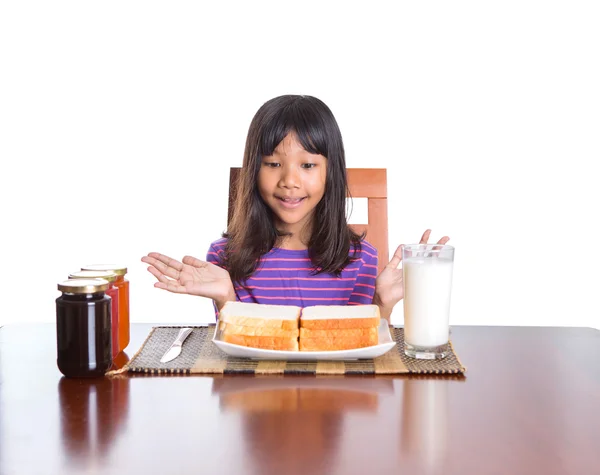 Joven malayo asiático preadolescente chica teniendo desayuno —  Fotos de Stock