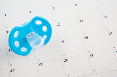 Blue Pacifier and Calendar clipart