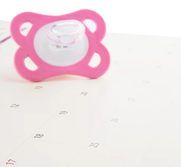 Rosa chupete y calendario — Foto de Stock