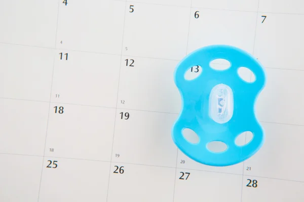 Blue Pacifier and Calendar — Stock Photo, Image