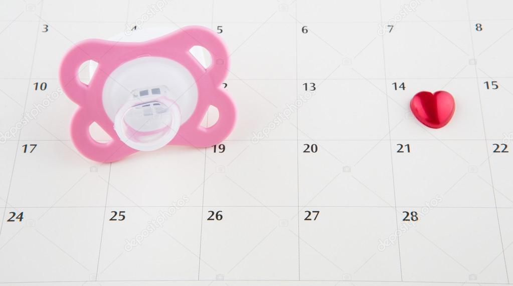 Pink Pacifier And Calendar