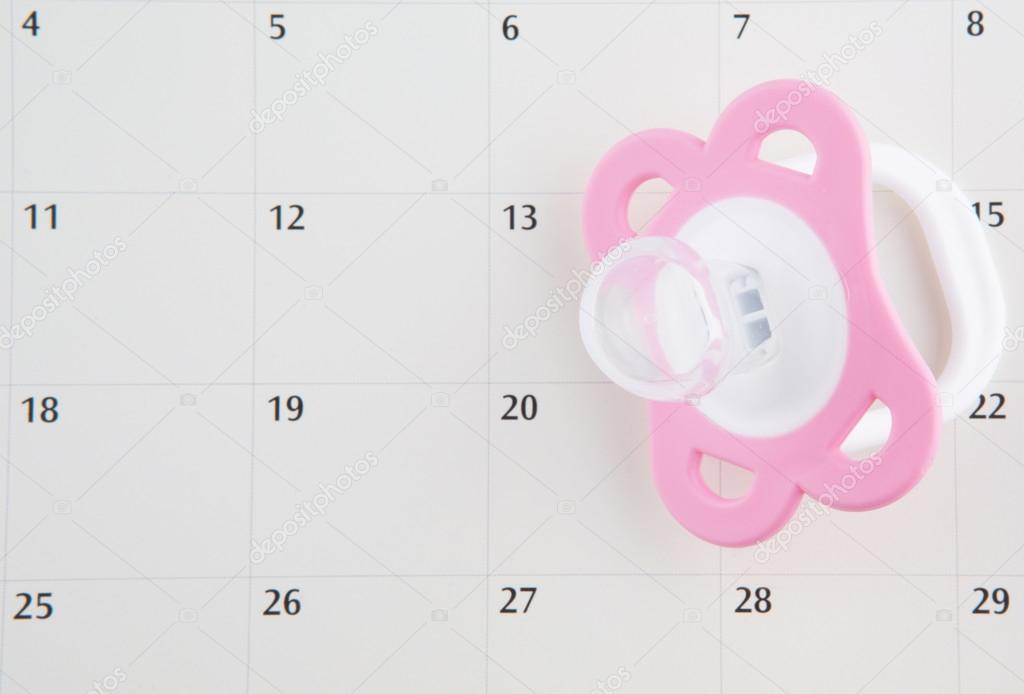 Pink Pacifier And Calendar