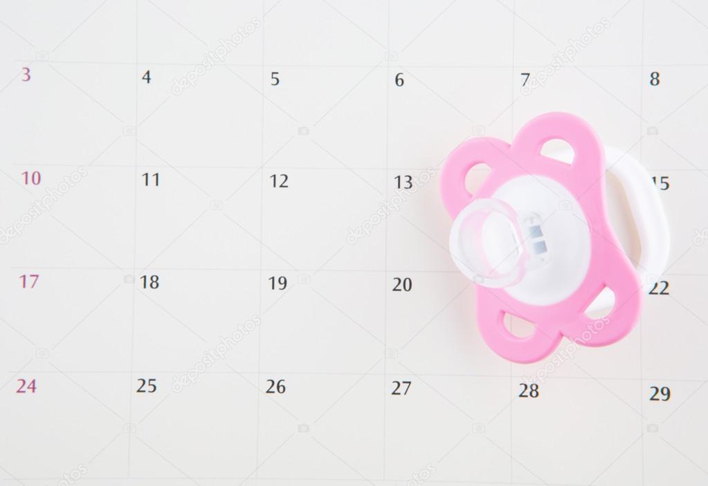 Pink Pacifier And Calendar