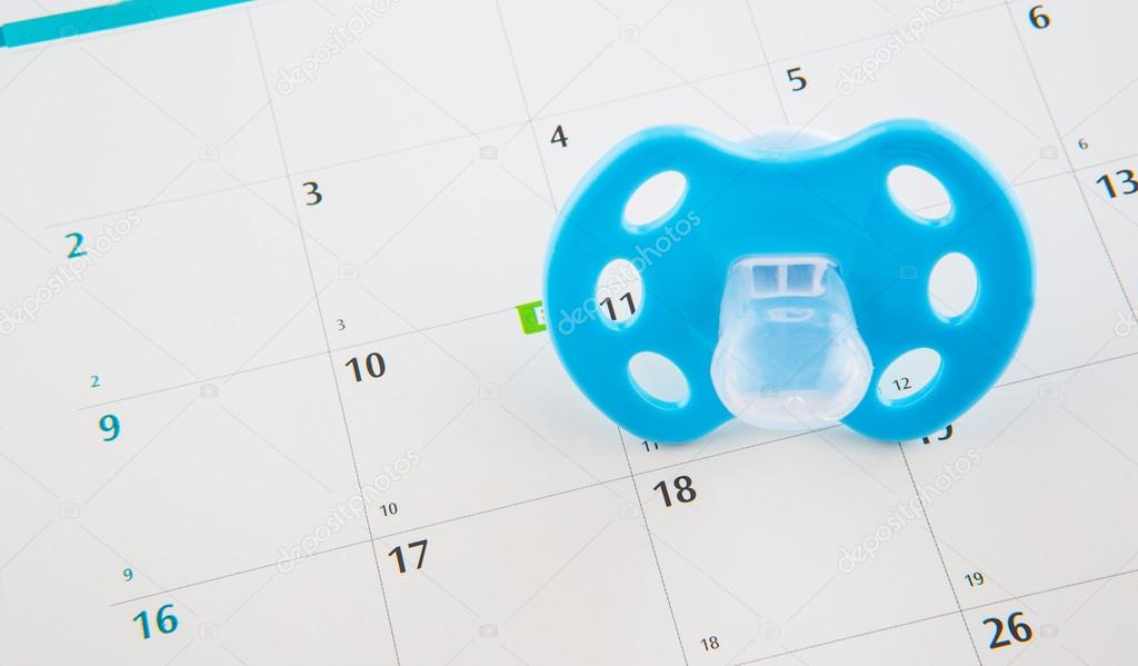 Blue Pacifier and Calendar