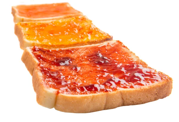 Mescolare la marmellata di frutta spalmata sul pane tostato — Foto Stock