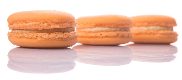 Oranžové barevné francouzské macarons — Stock fotografie