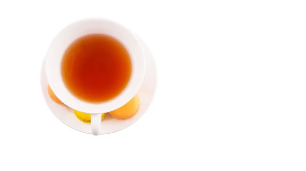 Una taza de té y macarrones franceses — Foto de Stock