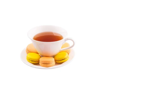 Cup Tea Yellow Orange Colored Macarons White Background — Stock Photo, Image
