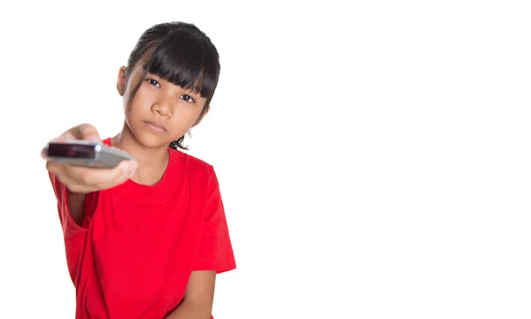 Genç Asyalı kız televizyon uzaktan kumanda ile — Stok fotoğraf