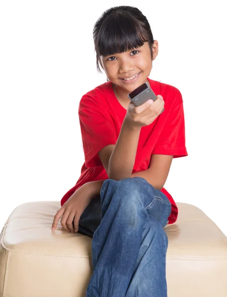 Young Asian Girl With Television Remote Control — Stock Photo, Image