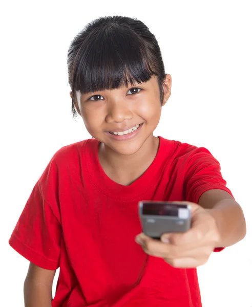 Young Asian Girl With Television Remote Control — Stock Photo, Image