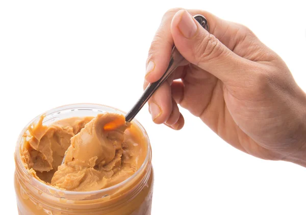 Weibliche Hand mit Erdnussbutter — Stockfoto