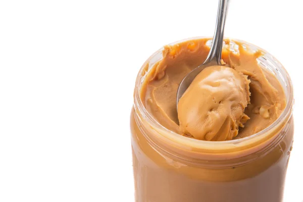 Manteiga de amendoim com colher pequena — Fotografia de Stock