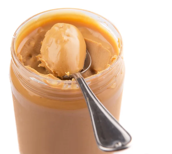 Erdnussbutter mit kleinem Löffel — Stockfoto