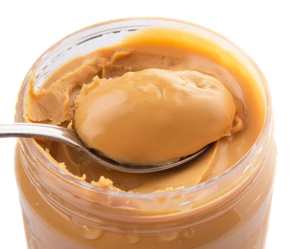 Erdnussbutter mit kleinem Löffel — Stockfoto