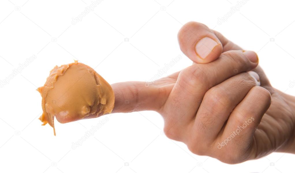 Female Finger With Peanut Butter