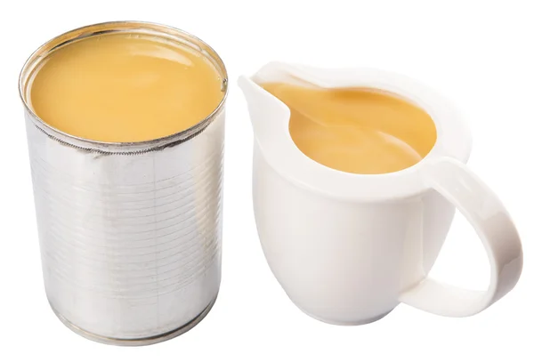 Condensed Milk In Tin Can And Milk Pitcher — Stock Photo, Image