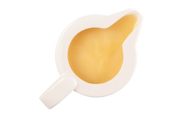 Yoğunlaştırılmış süt beyaz arka plan üzerinde bir küçük süt kabı içinde