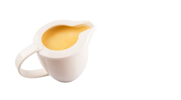 Kondensmilch Einem Kleinen Milchkrug Vor Weißem Hintergrund — Stockfoto