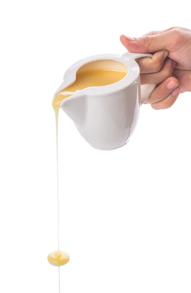 Versare latte condensato — Foto Stock
