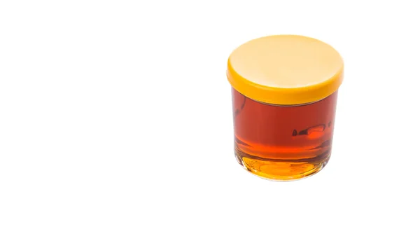 Miel en frasco de vidrio — Foto de Stock