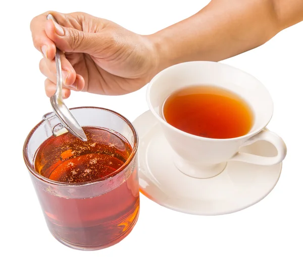 Miel de mezcla de mano femenina con té — Foto de Stock