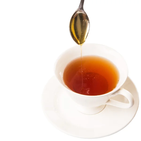 Misturando mel com chá — Fotografia de Stock