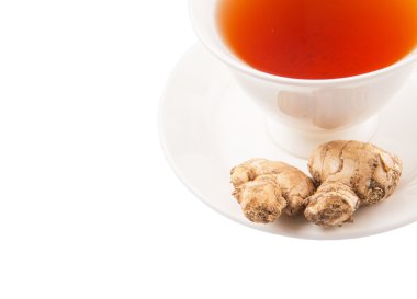 bir fincan çay ve zencefil kökü
